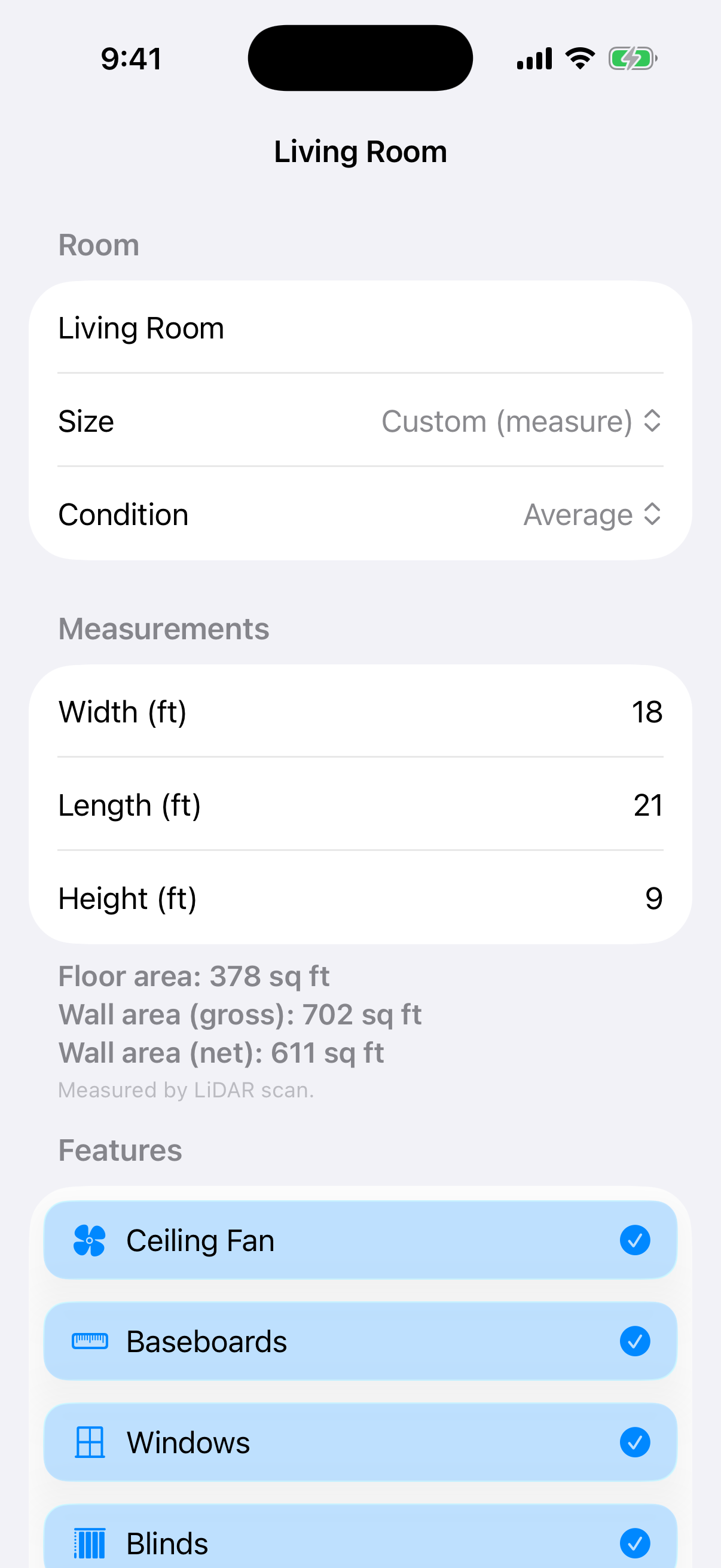 CleanQuotes room editor on iPhone showing an 18 by 21 by 9 foot living room measured by LiDAR with a feature checklist.